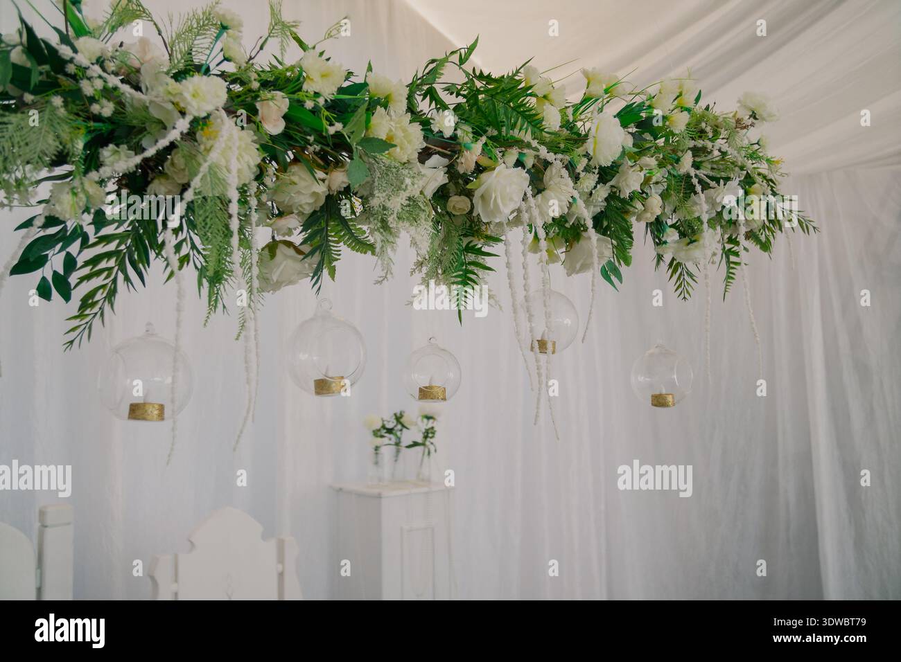Decorating a wedding table with fresh flowers Stock Photo