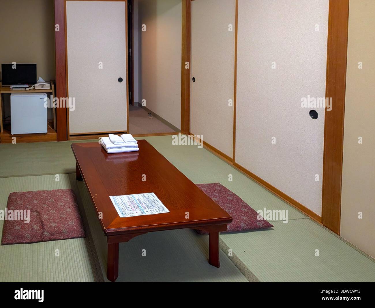 Washitsu Table Classic Japanese washitsu room featuring tatami flooring and a low ...