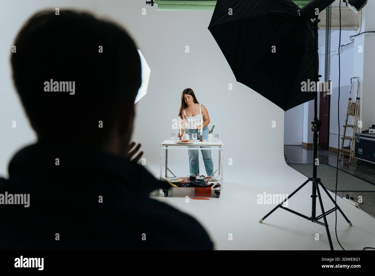 A behind-the-scenes look at a photography studio setup featuring a ...