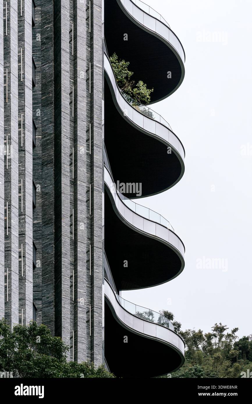 A modern architectural marvel in Taiwan features curved balconies with ...