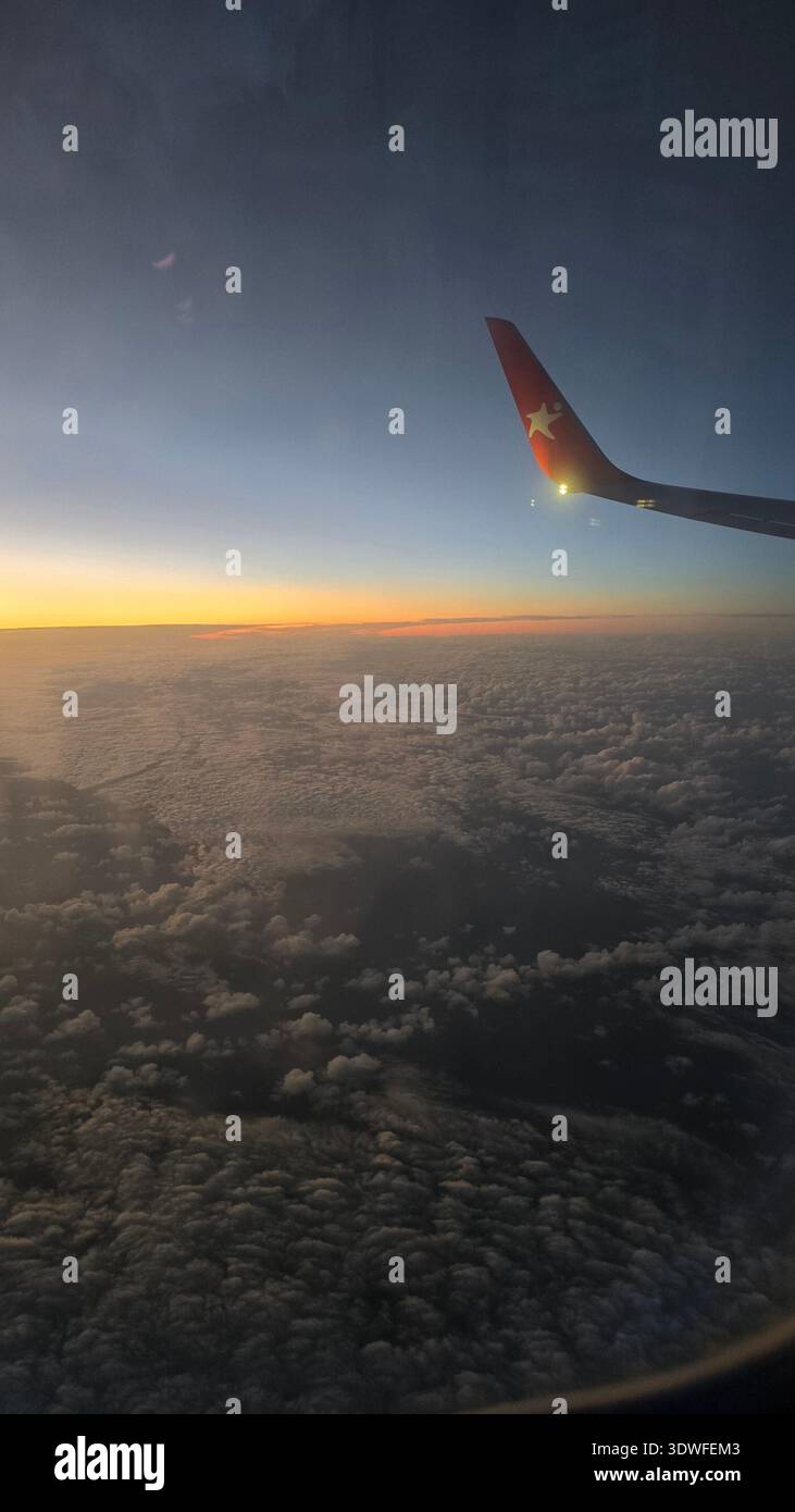 Flight above clouds sunrise hi-res stock photography and images - Alamy