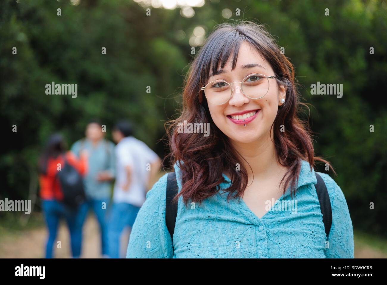 Female student smiling outdoors on campus Stock Photo