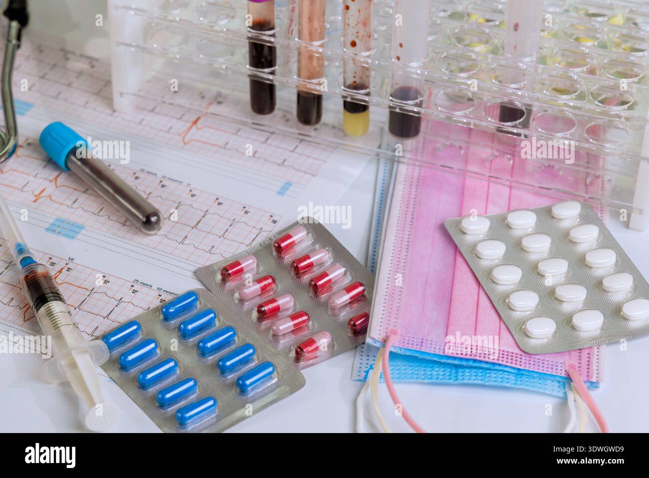 Medical tools medications are arranged on table for lab testing patient care in healthcare setting. Stock Photo