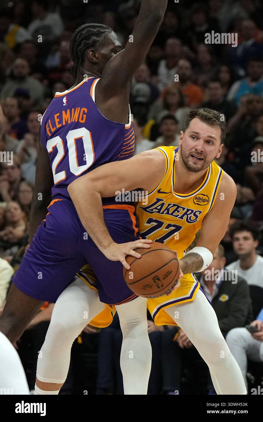Los Angeles Lakers guard Luka Doncic looks to pass around Phoenix Suns ...