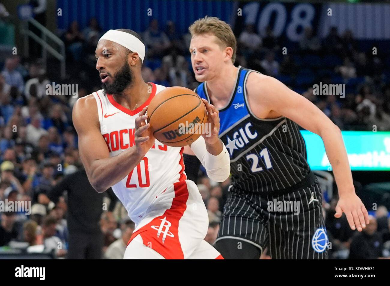 Houston Rockets guard Josh Okogie (20) drives past Orlando Magic ...