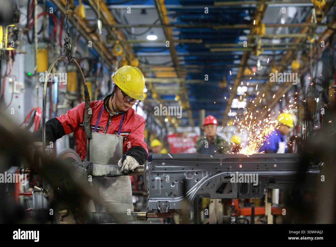 Factory Worker Rushing Workers rush to fulfill orders at an auto parts factory in Jiangdu High ...