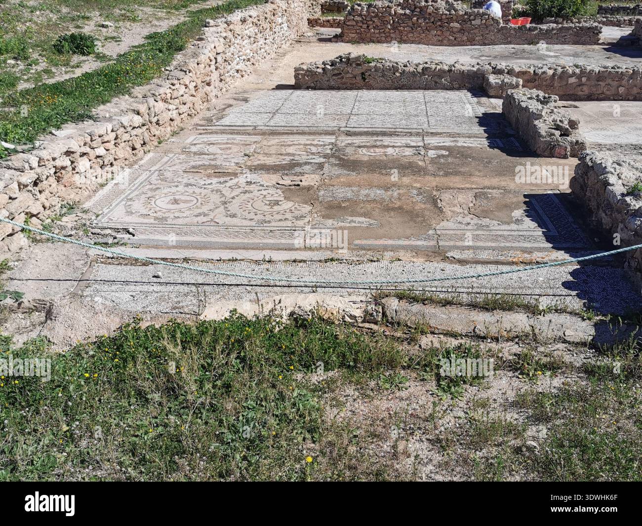 Roman ruins and ancient mosaics at Pupput Archaeological Site in Hammamet, Tunisia, showcasing the abandoned heritage from the region’s classical past. - Smartphone Captured Stock Image