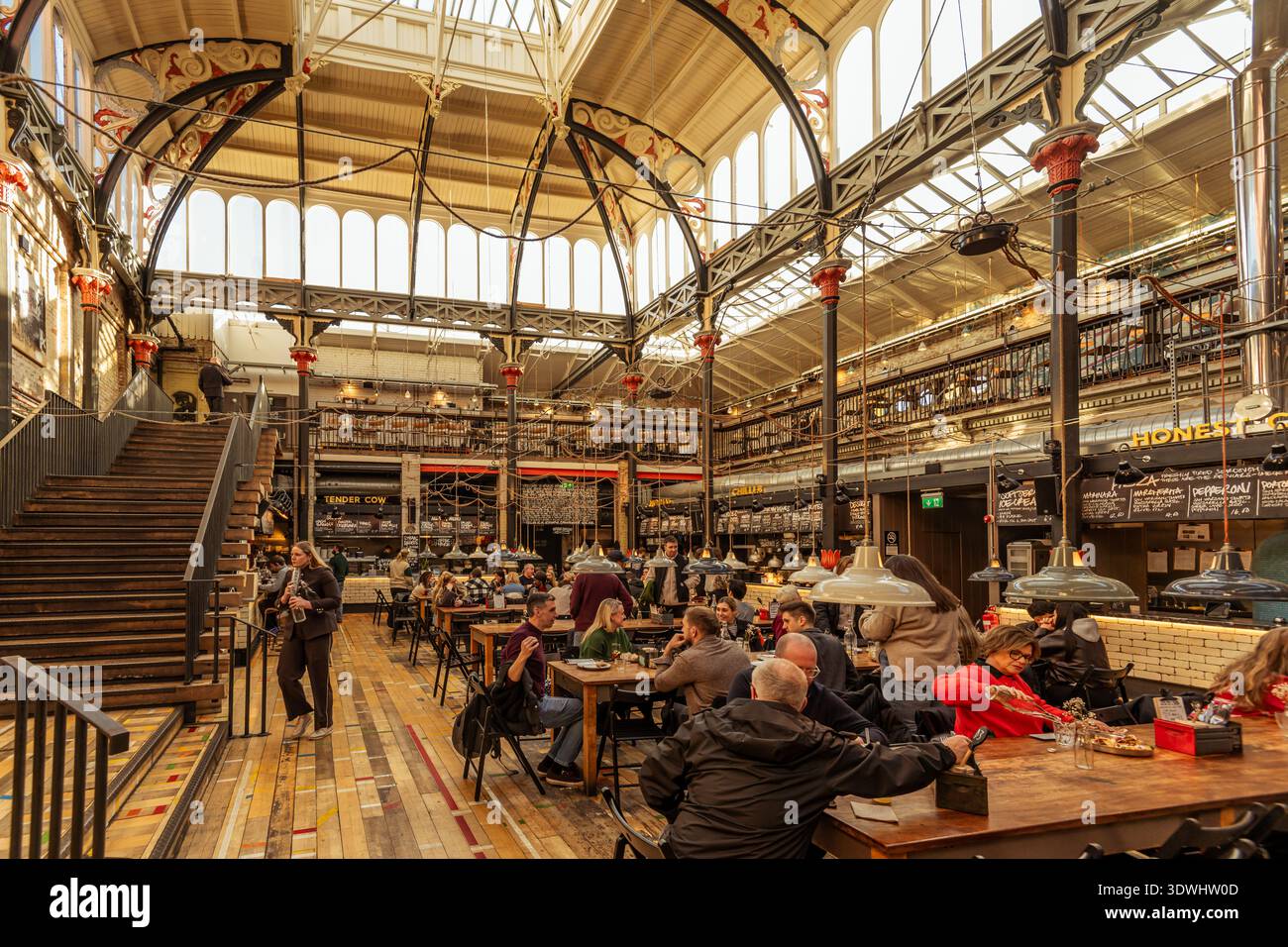 Mackie Mayor food hall interior, Manchester — busy diners beneath a ...