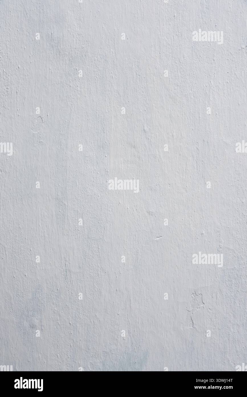 Clay wall is whitewashed by lime, textured background Stock Photo