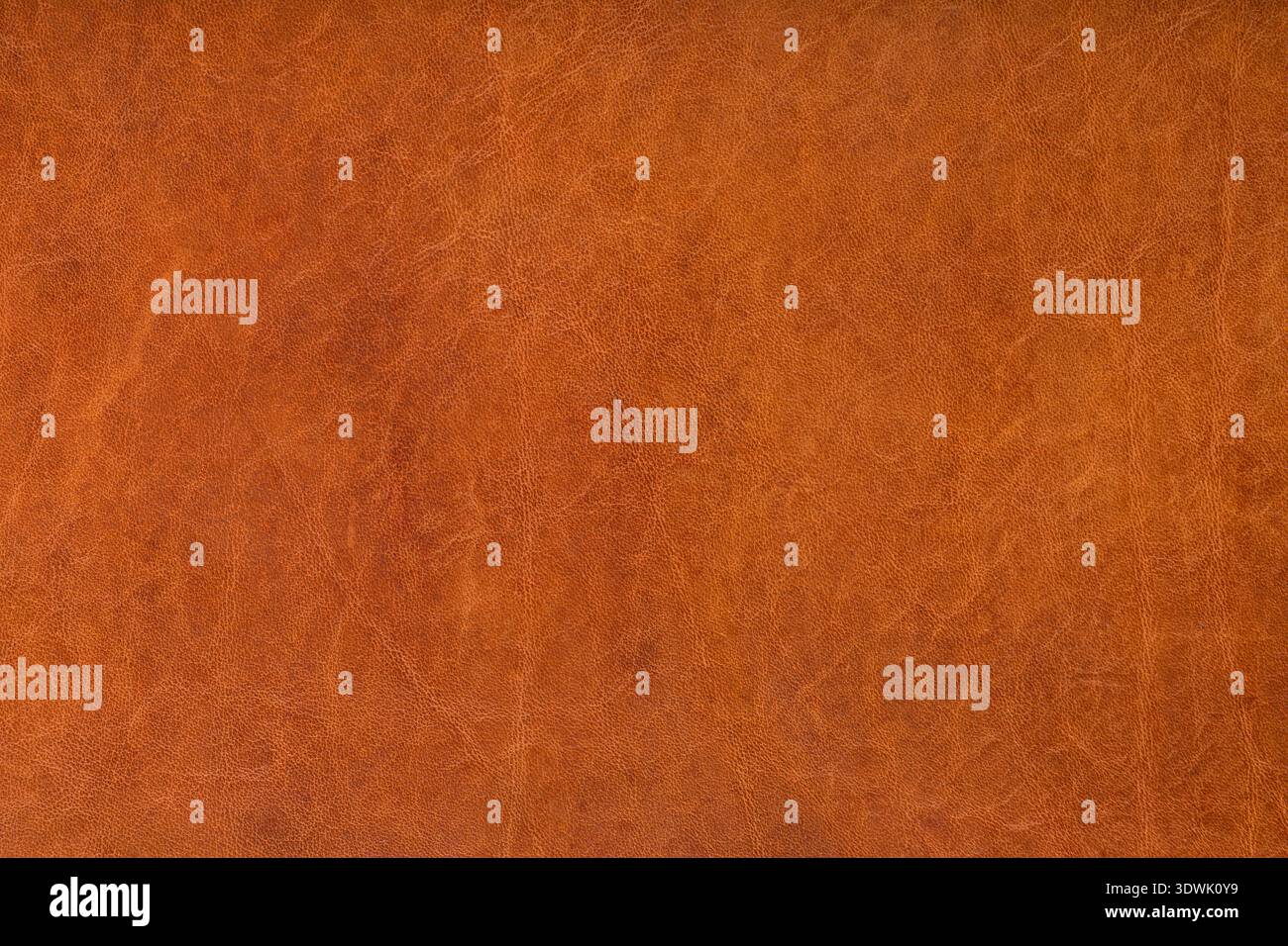 Textured leather background, orangeish medium brown Stock Photo