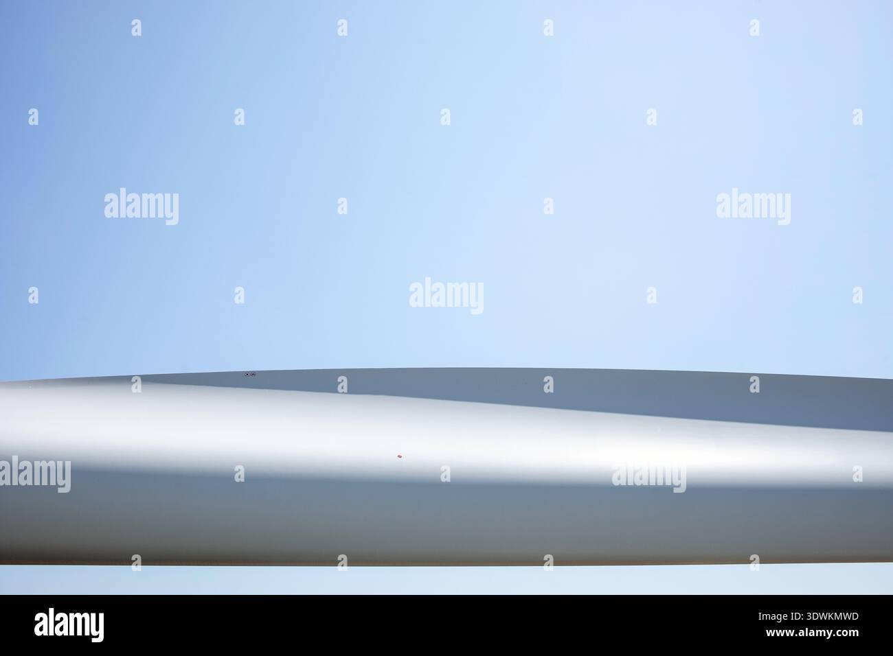 Abstract of wind turbine blade against plain sky Stock Photo