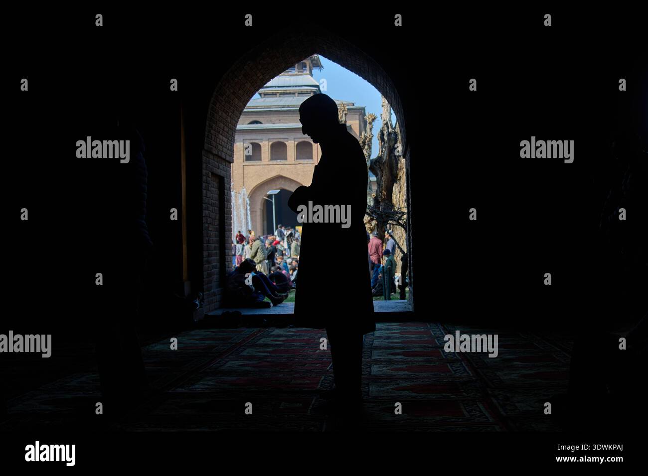 A Kashmiri Muslim man prays during the second Friday of the fasting ...
