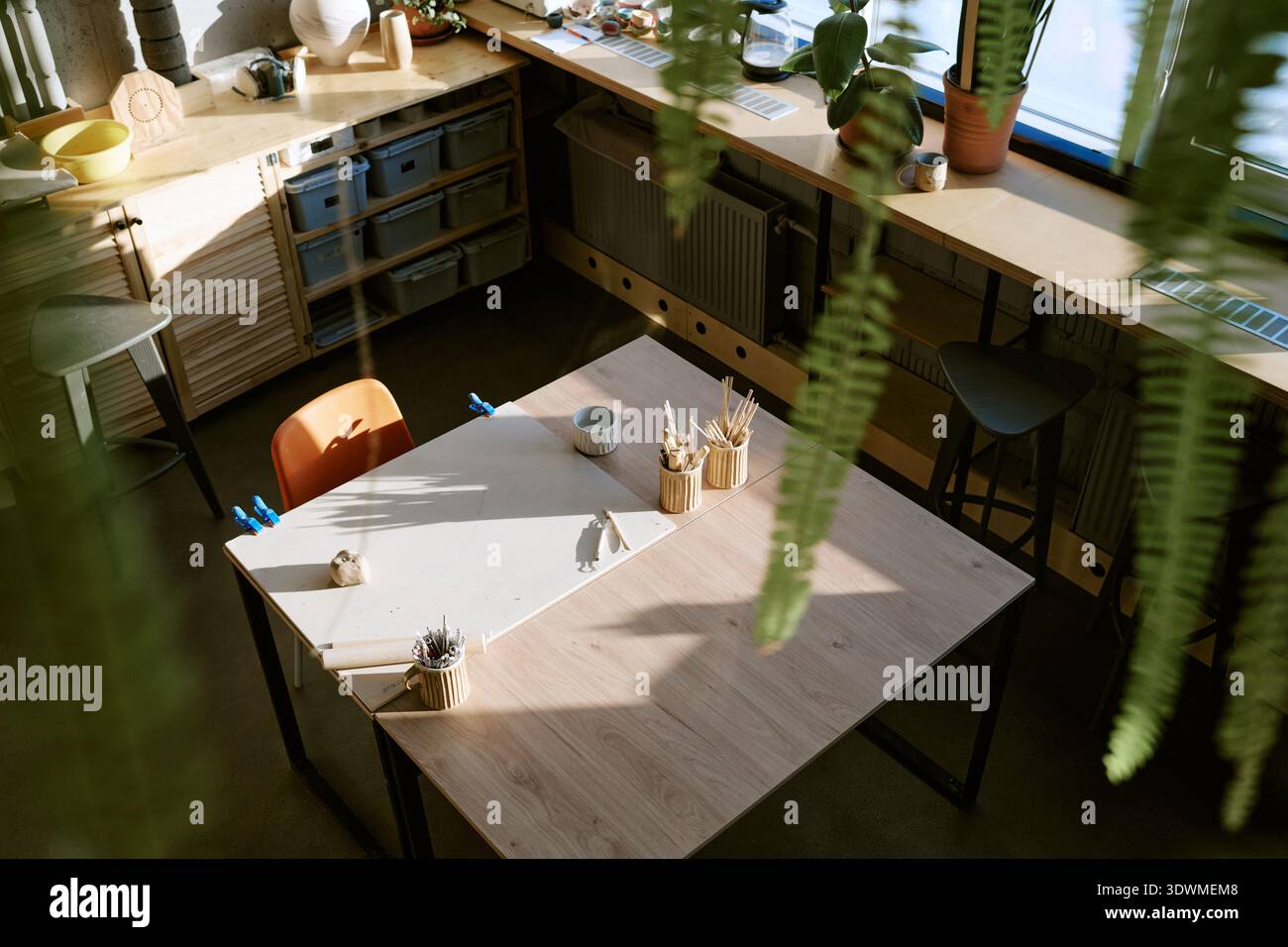 Empty Art Classroom Showing Sunlight Illuminating Creative Workspace Stock Photo