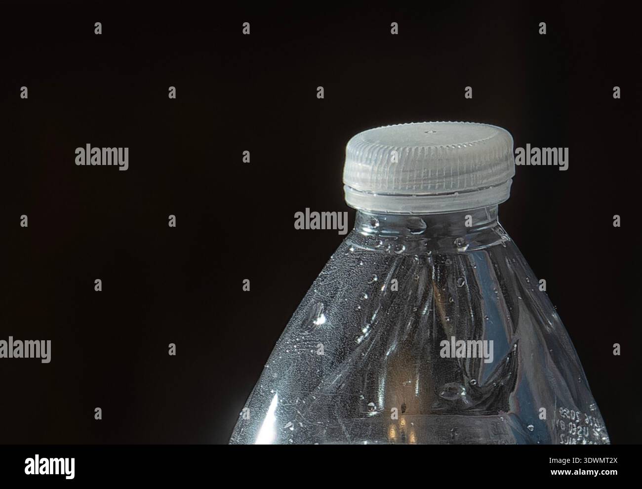 The top of a clear plastic water bottle Stock Photo