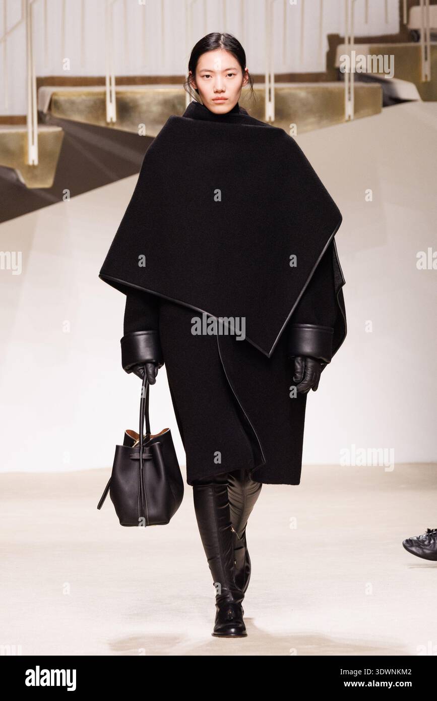 A model walks the runway at the Tod's fashion show during the Milan ...