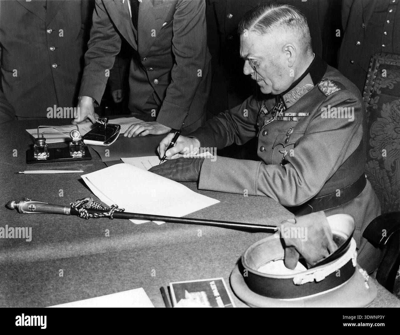 Surrender Defeat This poignant black and white photograph from May 8, 1945, captures ...