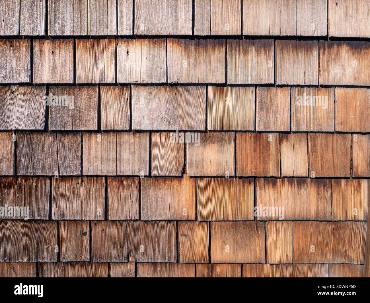 Natural weathered wooden shingles texture background, traditional rustic cedar shakes wall cladding pattern Stock Photo