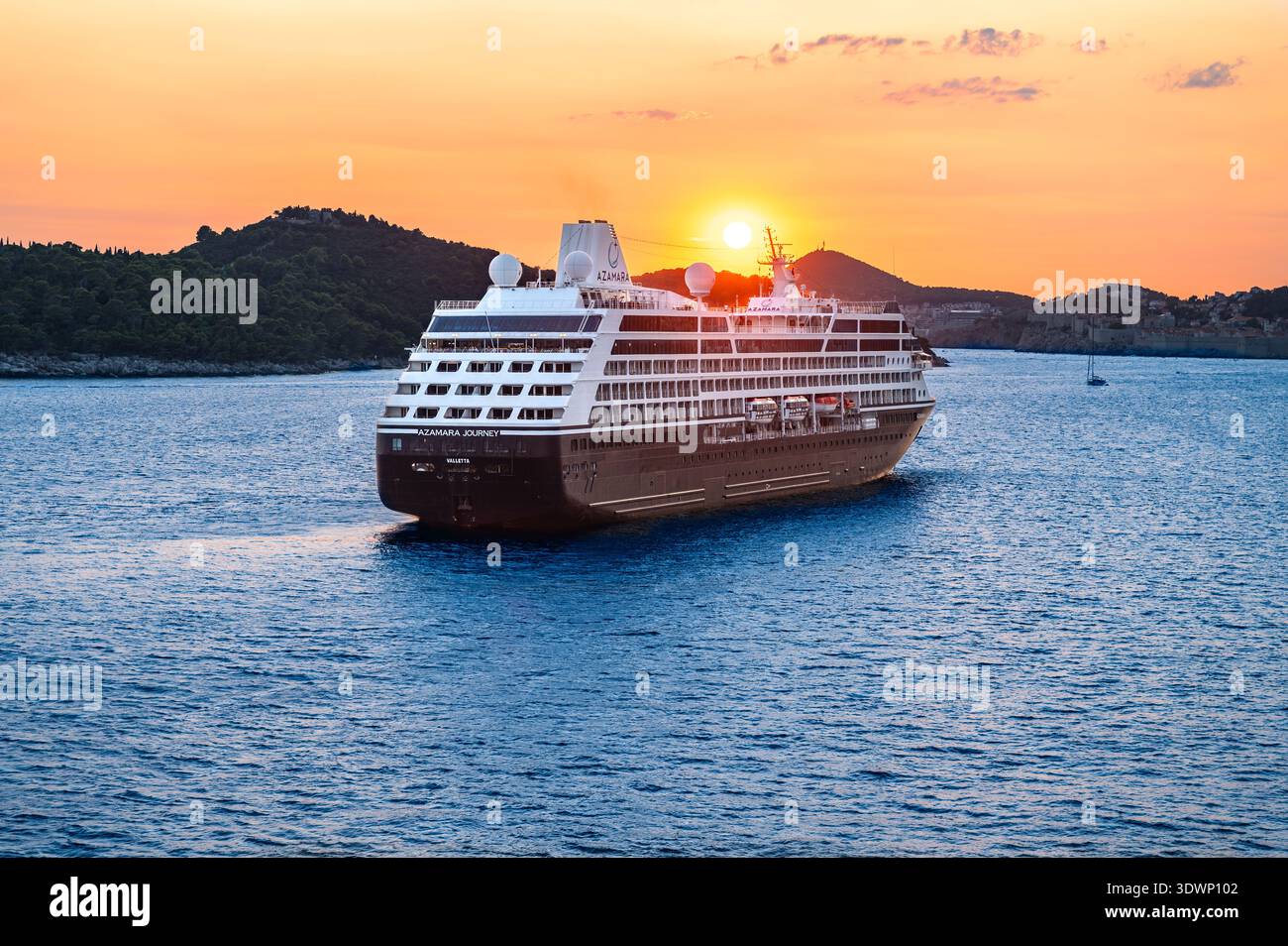 Dubrovnik, Croatia - July 25, 2024: Cruise Ship Azamara Journey Sailing in Harbor of Dubrovnik at Sunset Stock Photo