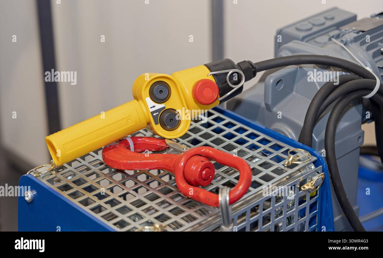 Wired Remote Control Lifting With Emergency Stop Button in Workshop Stock Photo