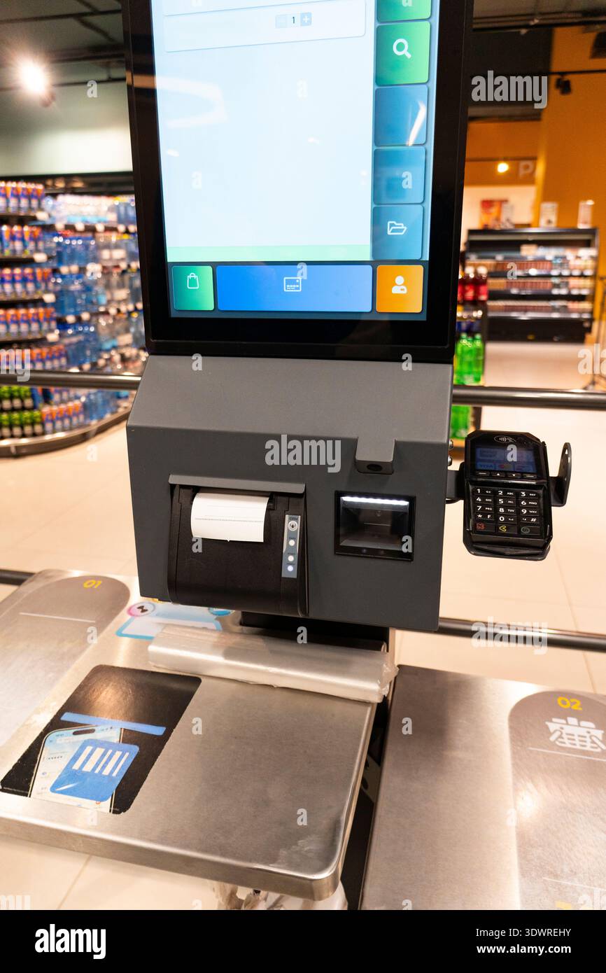 Self checkout terminal in a supermarket with payment card reader and ...