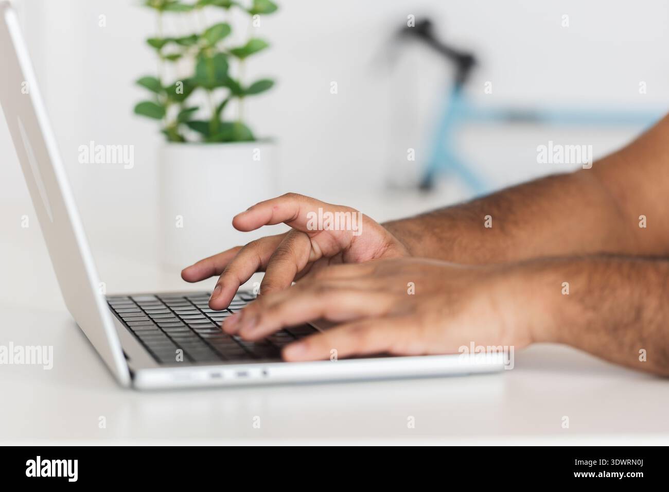 Close up hands using laptop computer Stock Photo
