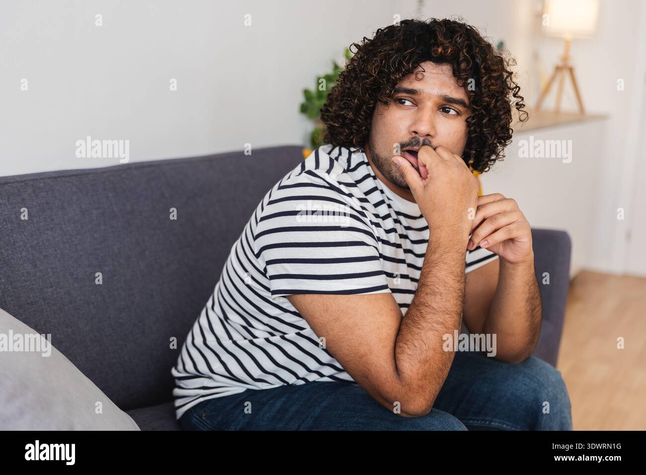 Man curly hair beard biting hi-res stock photography and images - Alamy