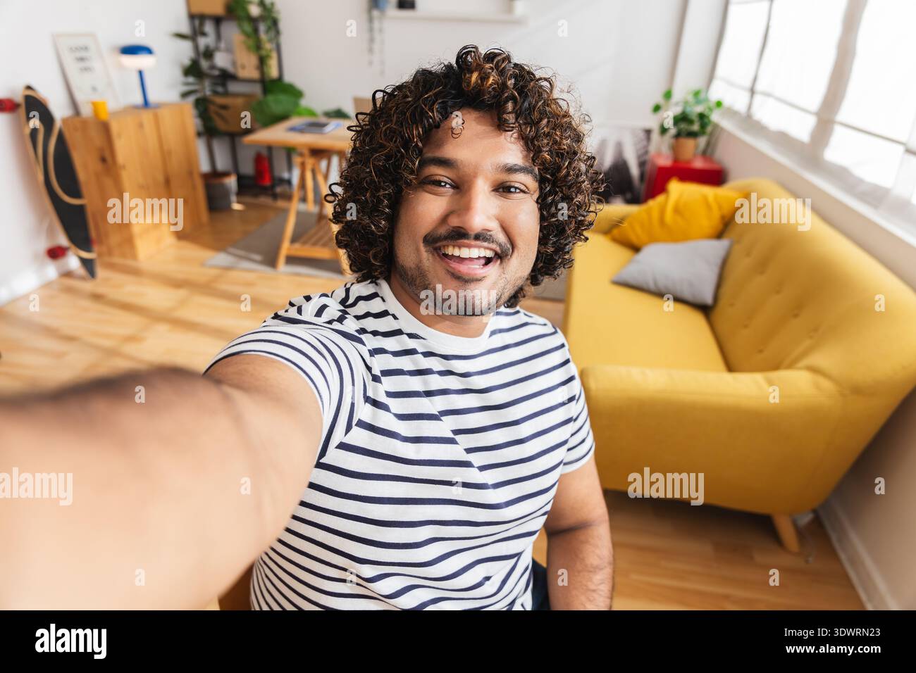 Young Indian man taking selfie portrait home studio Stock Photo