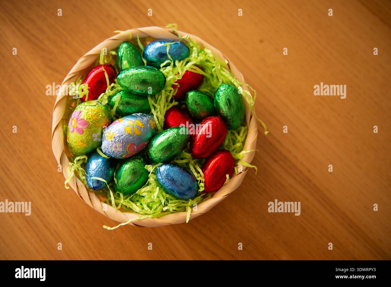 Basket with chocolate colored eggs Easter decor Stock Photo