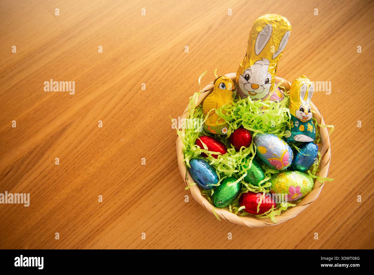 Basket with chocolate colored eggs Easter decor Stock Photo
