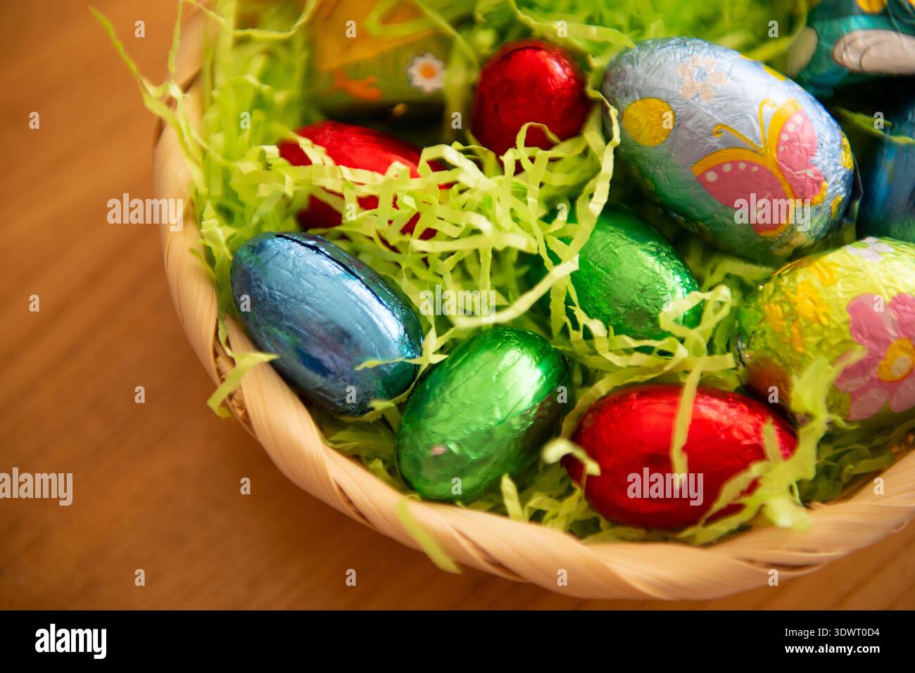 Basket with chocolate colored eggs Easter decor Stock Photo
