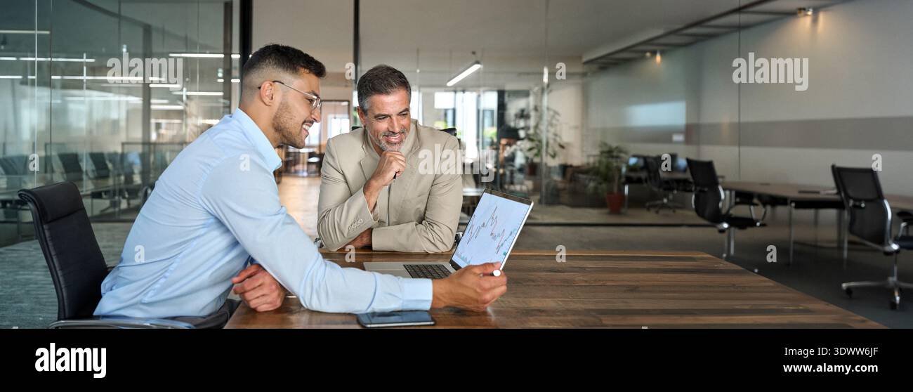 Financial advisor consulting investor explaining financial trade stock market. Stock Photo