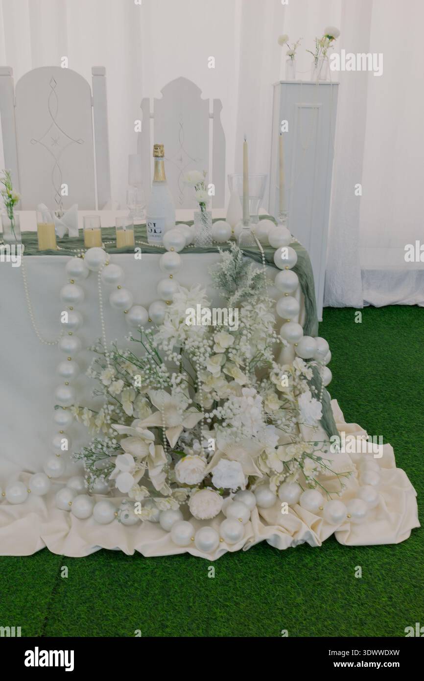 Decorating a wedding table with fresh flowers Stock Photo