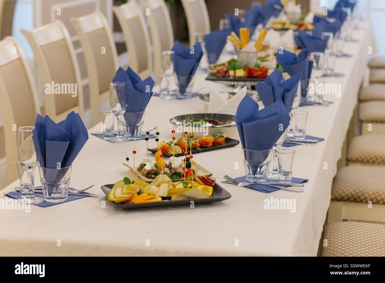 A festive table set with snacks for guests Stock Photo