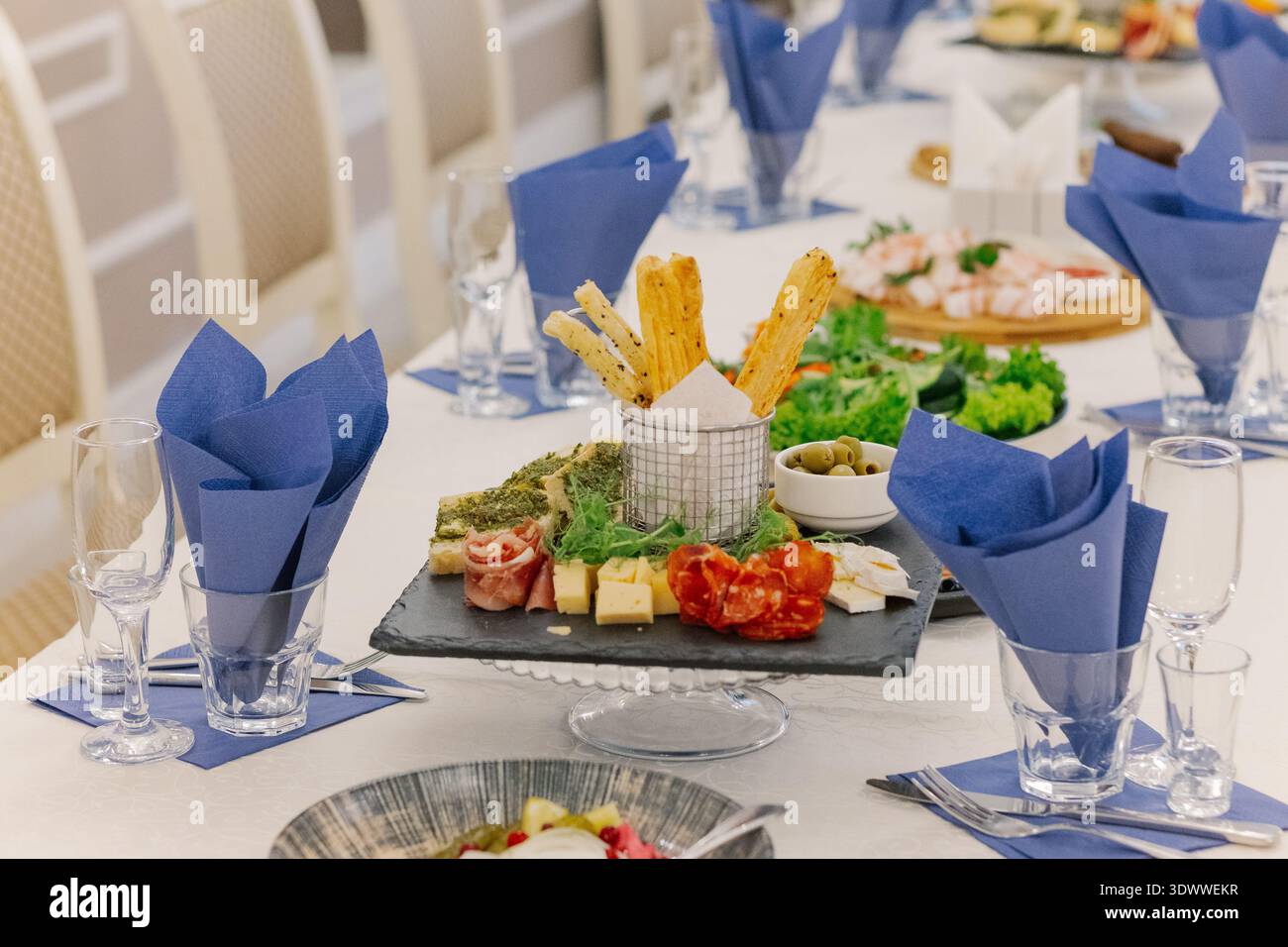 A festive table set with snacks for guests Stock Photo