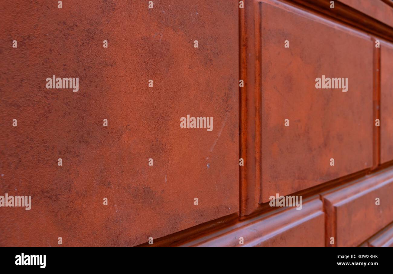 Textured Terracotta Stone Wall with Decorative Rectangular Rustication Stock Photo