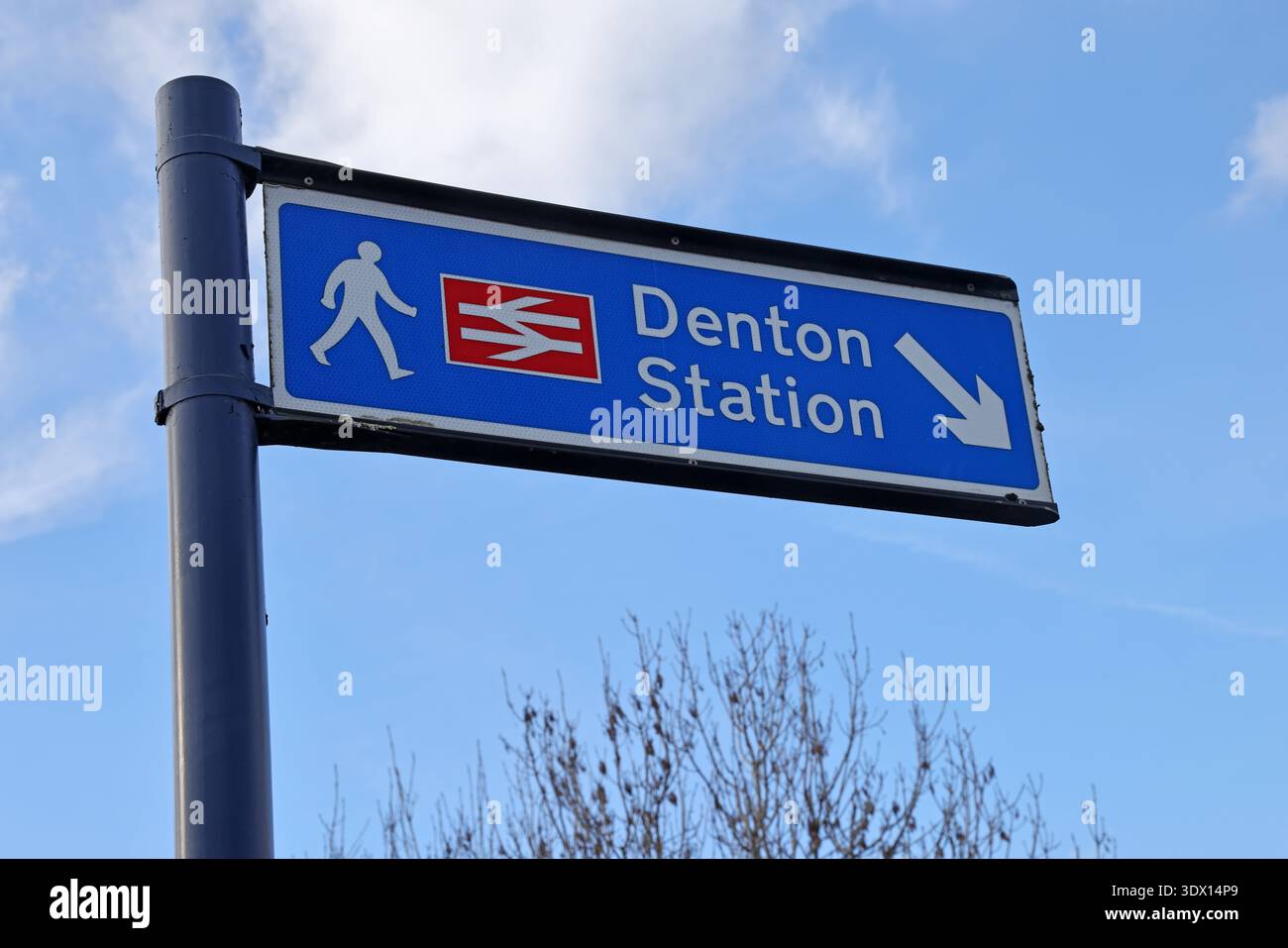 Direction sign for Denton Station in Greater Manchester, a little-used railway station known for its extremely sparse weekly passenger service Stock Photo