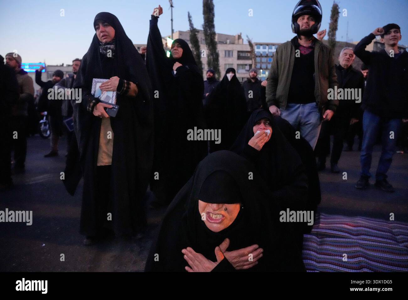 Khamenei Supporters Government supporters mourn and chant slogans in a gathering after ...