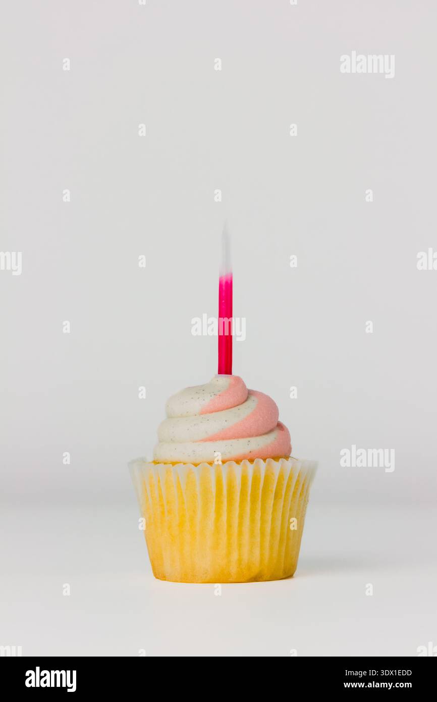 A vanilla cupcake on white background Stock Photo