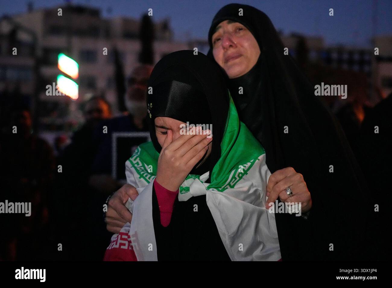 Khamenei Supporters Government supporters mourn in a gathering after state TV officially ...