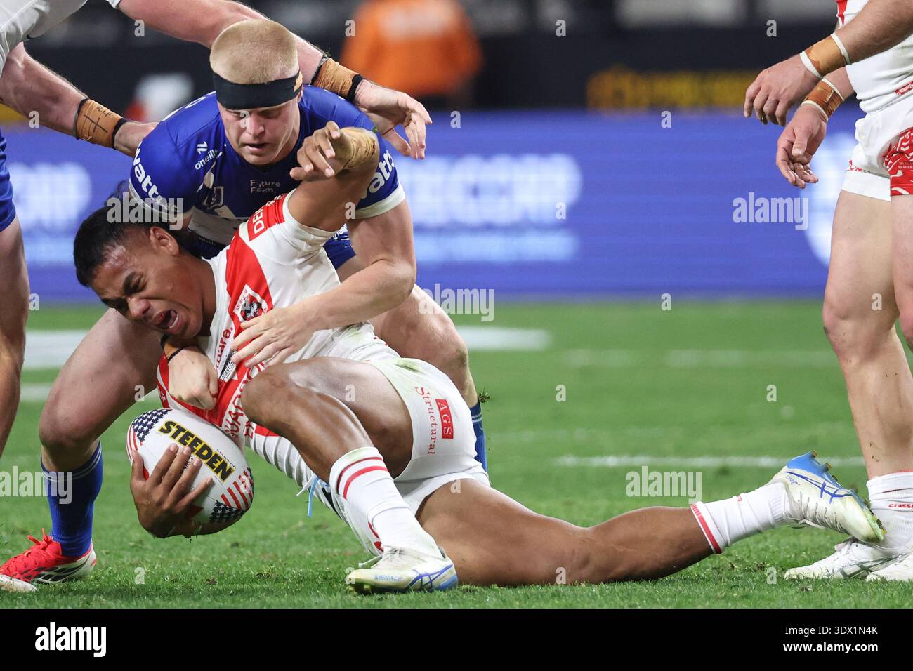Dragons Luciano Leilua is tackled by Bulldogs Bailey Hayward, top ...