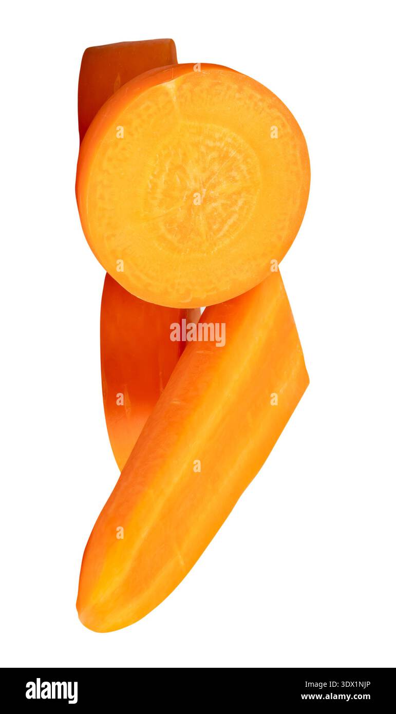 Front view of orange carrot slices in circle and stick shapes in stack is isolated on white background with clipping path. Stock Photo