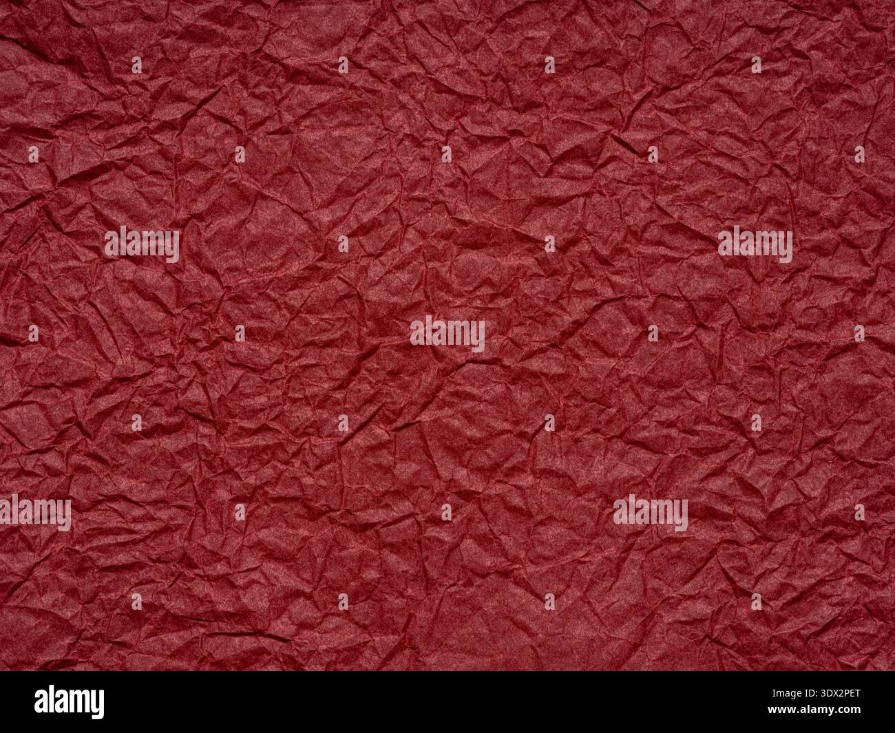 Red crumpled paper texture. Blank dark page pattern for winter season Christmas festival card, new year designs decoration, background concepts, text Stock Photo