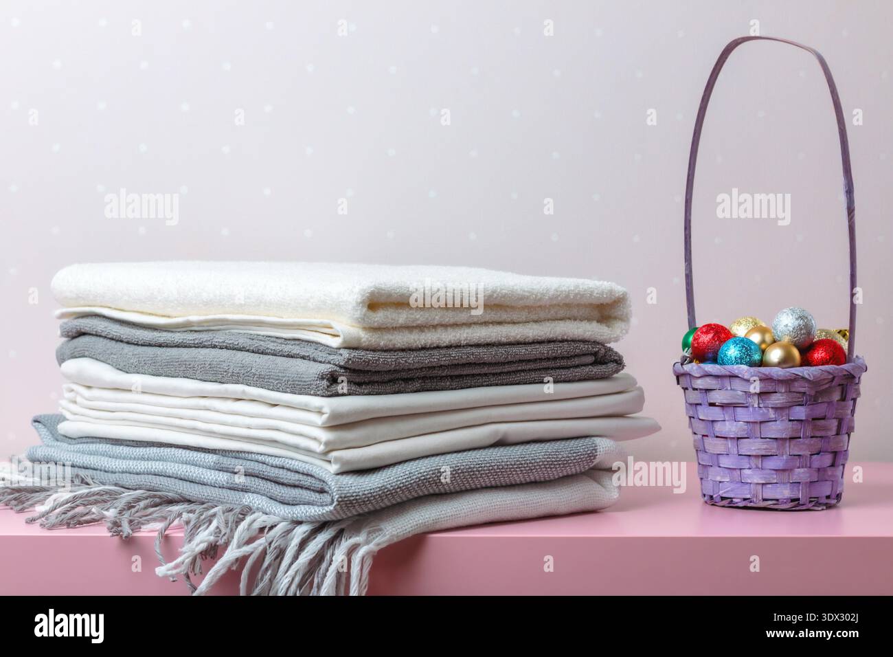 A stack of folded blankets, sheets and towels. Stock Photo
