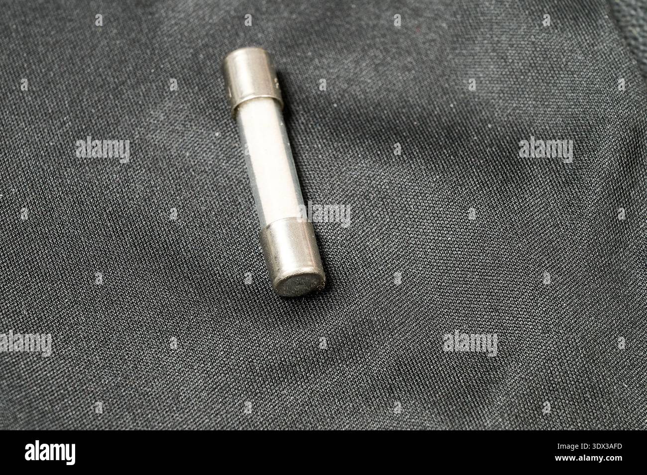 A small transparent fuse on a leather background Stock Photo