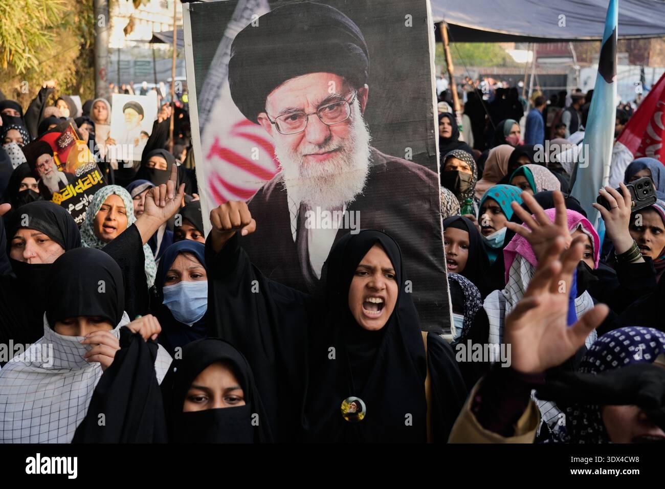 Shiite Muslims chant anti U.S slogans during a rally to condemn the ...