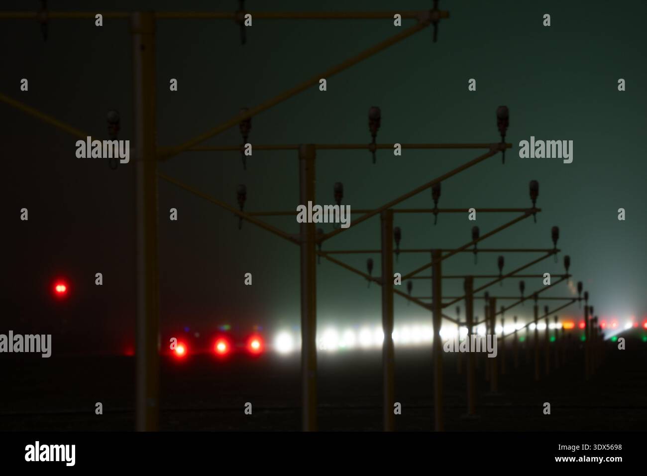 Runway approach lighting system in thick fog Stock Photo - Alamy
