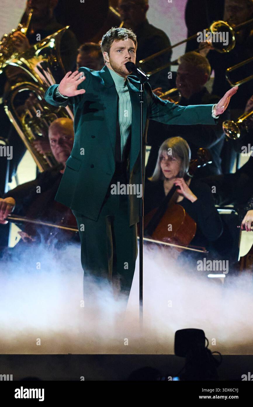 Alex Warren performs during the Brit Awards 2026 in Manchester, England ...