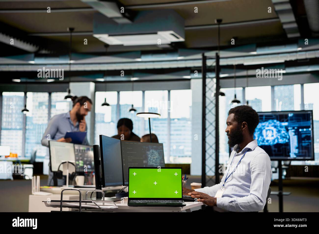 Engineer in office using AI automation scripts on isolated screen laptop to reduce repetitive coding tasks. IT professional using artificial intelligence technology on mockup notebook Stock Photo