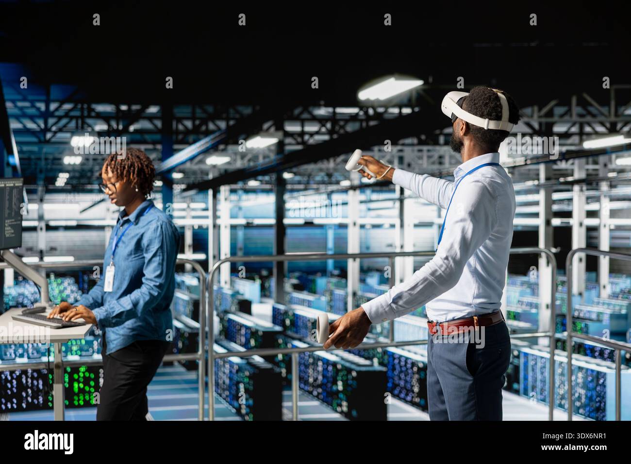 Data center programmer on industrial platform using virtual reality tech, collaborating on tasks. Server room IT professionals visualizing large language model architecture using VR headset. Stock Photo