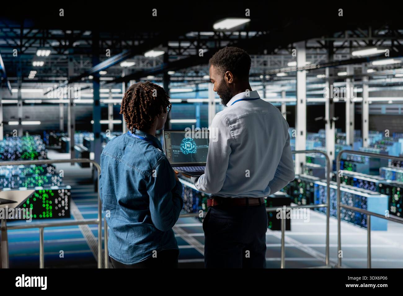 Server hub teamworking IT experts visualizing large language model architecture using laptop on elevated industrial platform. Data center system administrators collaborating on tasks. Stock Photo